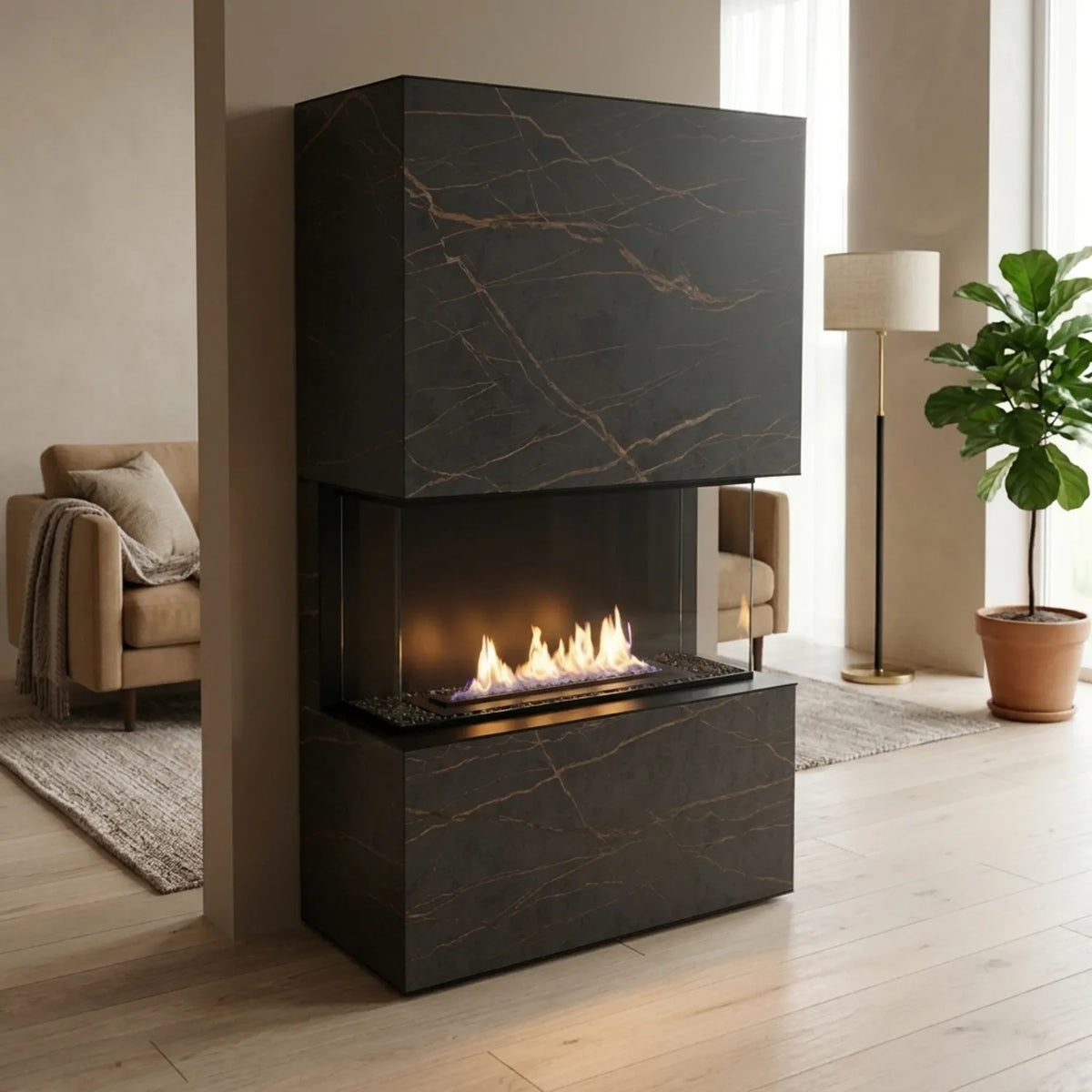 Planika Stone Laurent freestanding bioethanol fireplace in black marble-look Dekton, placed against a wall in a modern living room with a sofa and plant.