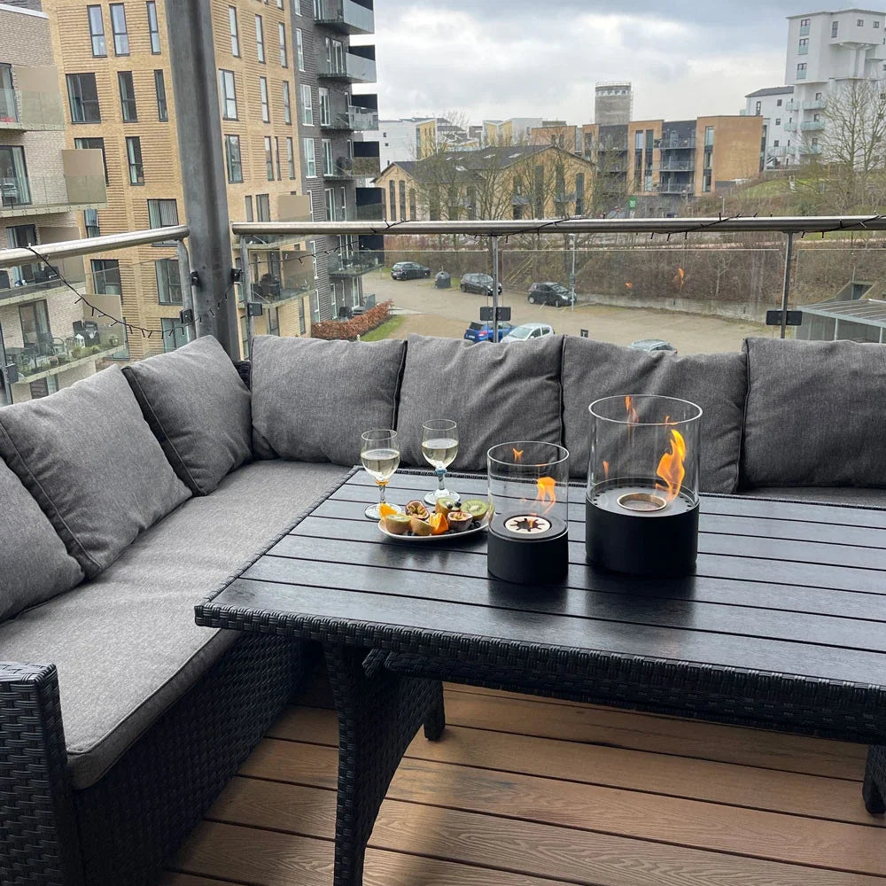Kennington fireplace lit on an outdoor balcony table with wine and snacks, genuine customer photo
