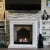 Xaralyn Cadiz white natural stone bioethanol fireplace in classic mantel fireplace design